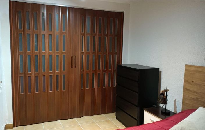 puerta plegable con cristal