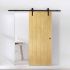 puerta corredera clasica fabricada en madera de pino instalada en una habitacion moderna